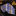 Blue and gold patterned tie on a dark surface