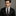 Black, Orange Stripe Tie and Matching Square on man Wearing Black Suit
