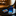 Blue tie and wallet with desert landscape design on a dark surface