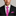 Man wearing a black suit with a pink patterned tie and pocket square on a gray background