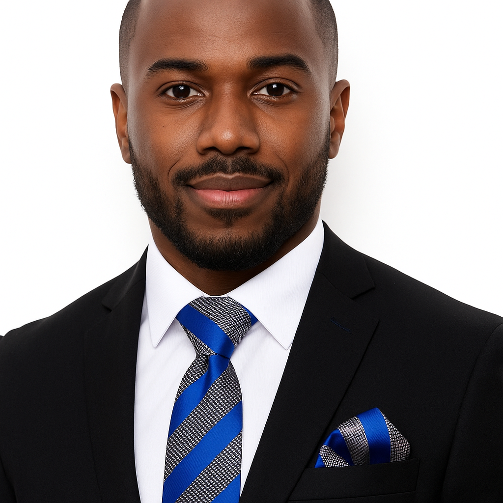 Man wearing a black suit with a blue and gray striped tie and pocket square on a white background