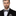 Silver, Black Geometric Bow Tie and Pocket Square on Man Wearing Suit