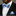 Man wearing a black suit with a blue stripe bow tie and pocket square on a gray background