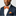 Man Wearing Orange and White Stripe Bow Tie and Square 