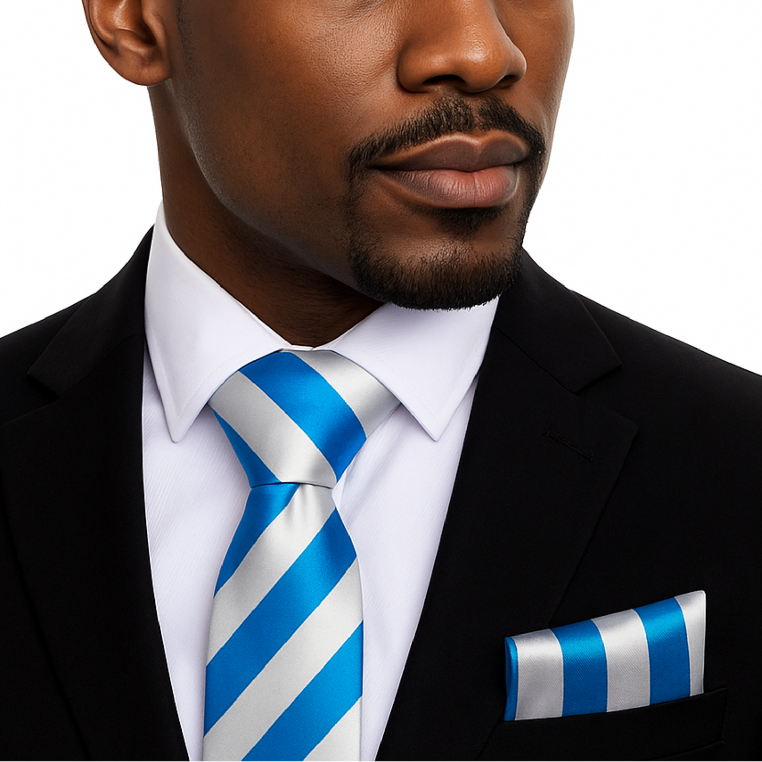 Man wearing a black suit with a blue and white striped tie and pocket square on a white background