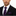 Man wearing a black suit with a purple block stripe tie and pocket square on a white background