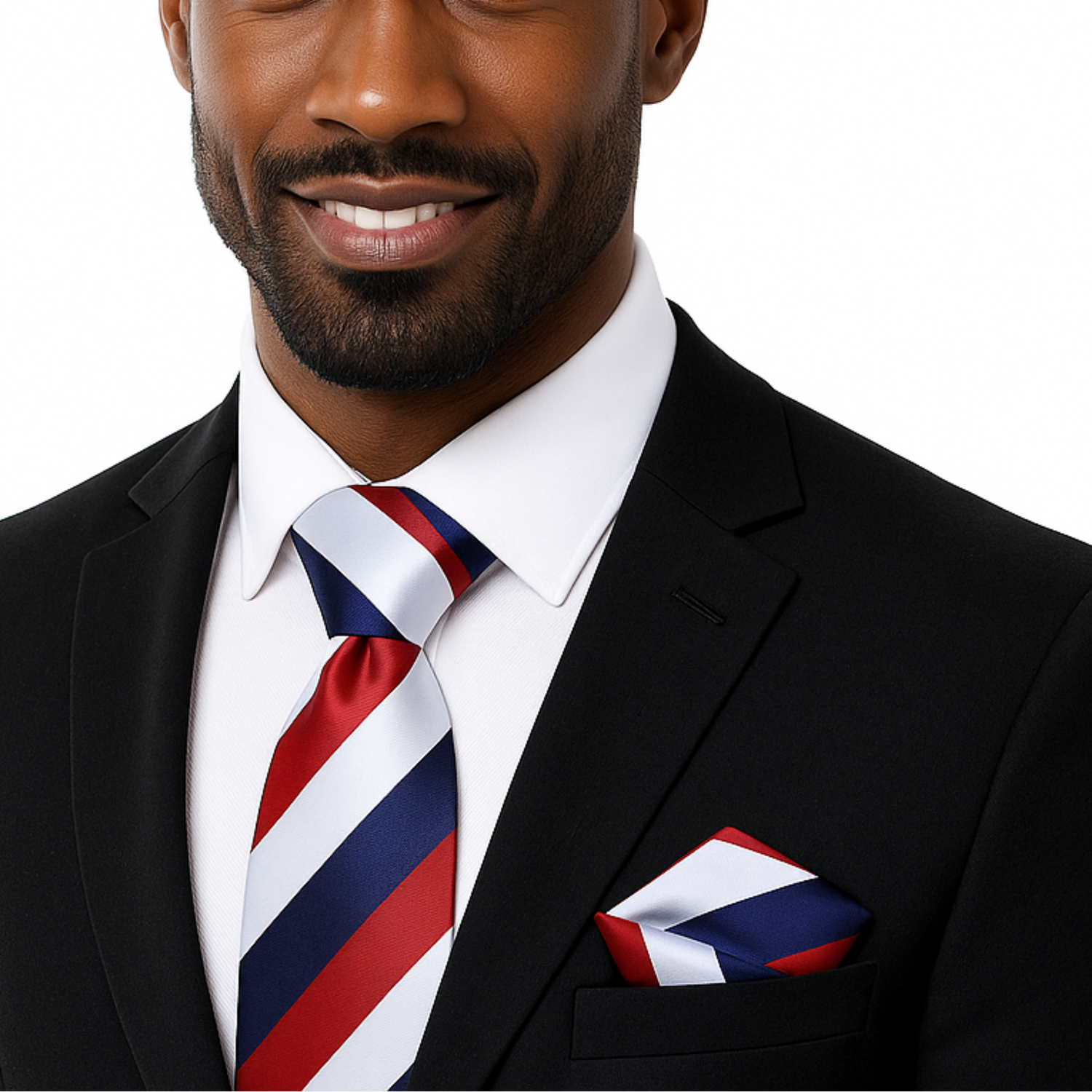 Man wearing a black suit with a red, white, and blue striped tie and pocket square on a white background