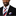 Man wearing a black suit with a red, white, and blue striped tie and pocket square on a white background