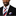 Man wearing a black suit with a red, white, and blue striped tie and pocket square on a white background