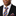 Man wearing a black suit with an orange and blue striped tie and pocket square.