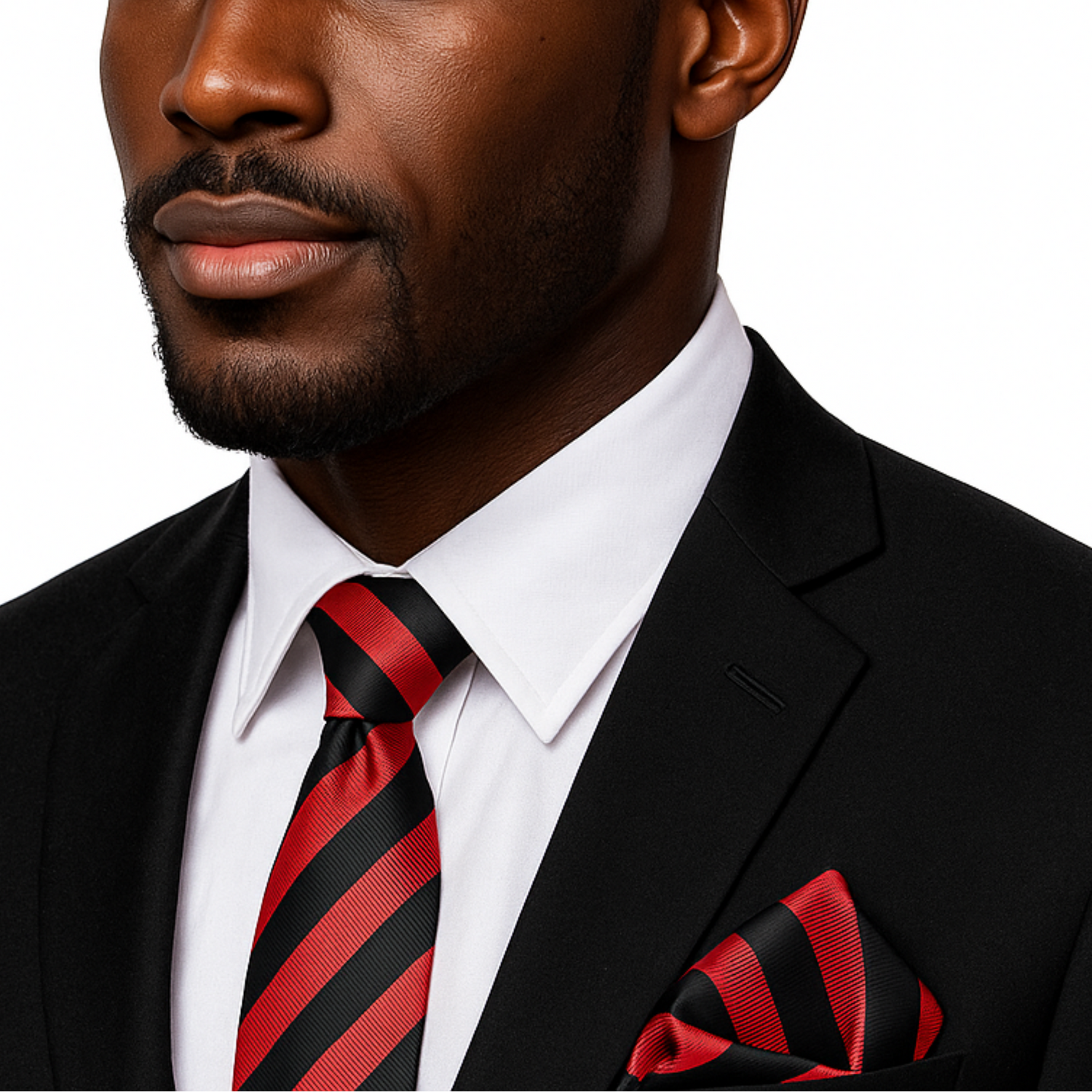 Man wearing a black suit with a red and black striped tie and pocket square on a white background