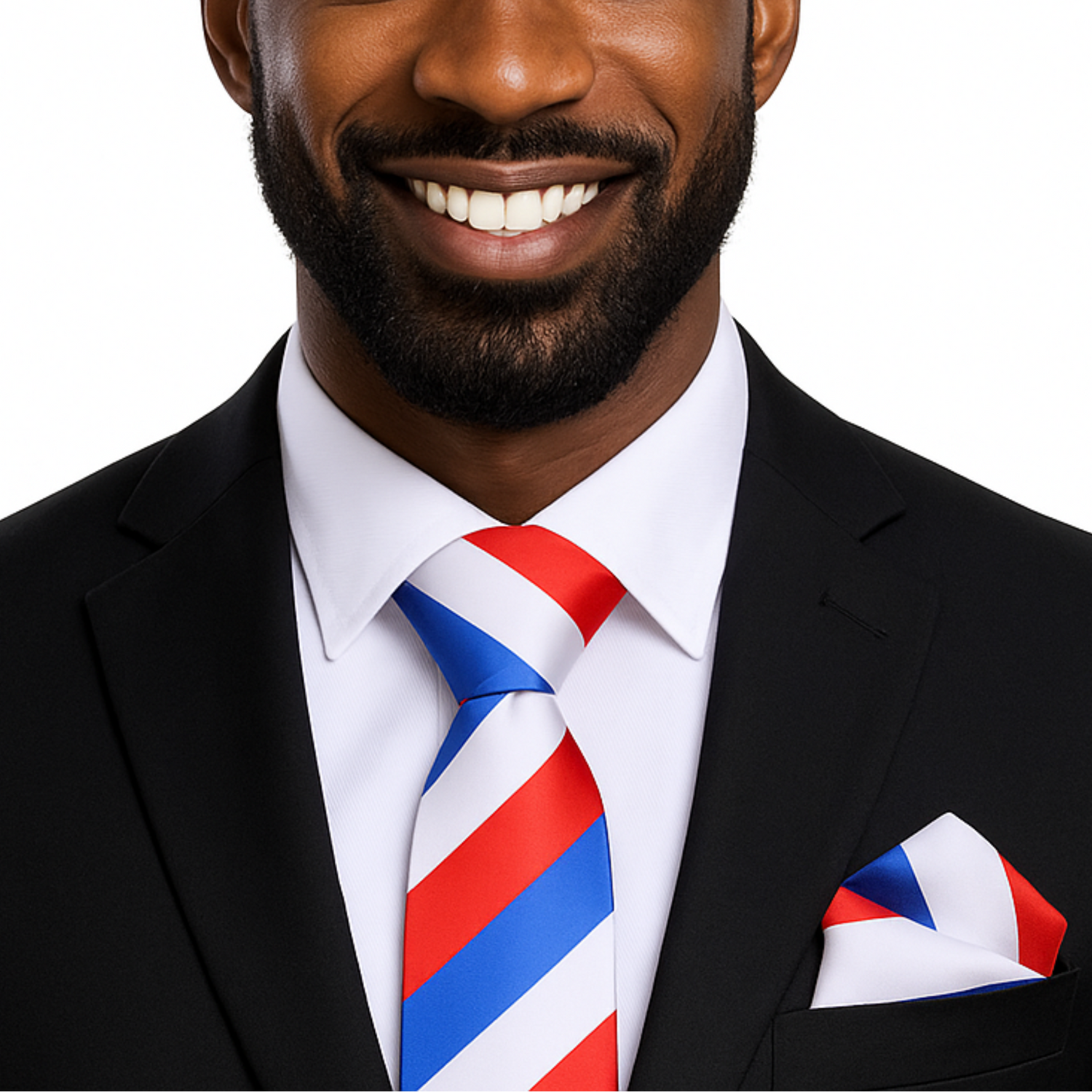 Man wearing a black suit with a red, white, and blue striped tie and pocket square on a white background