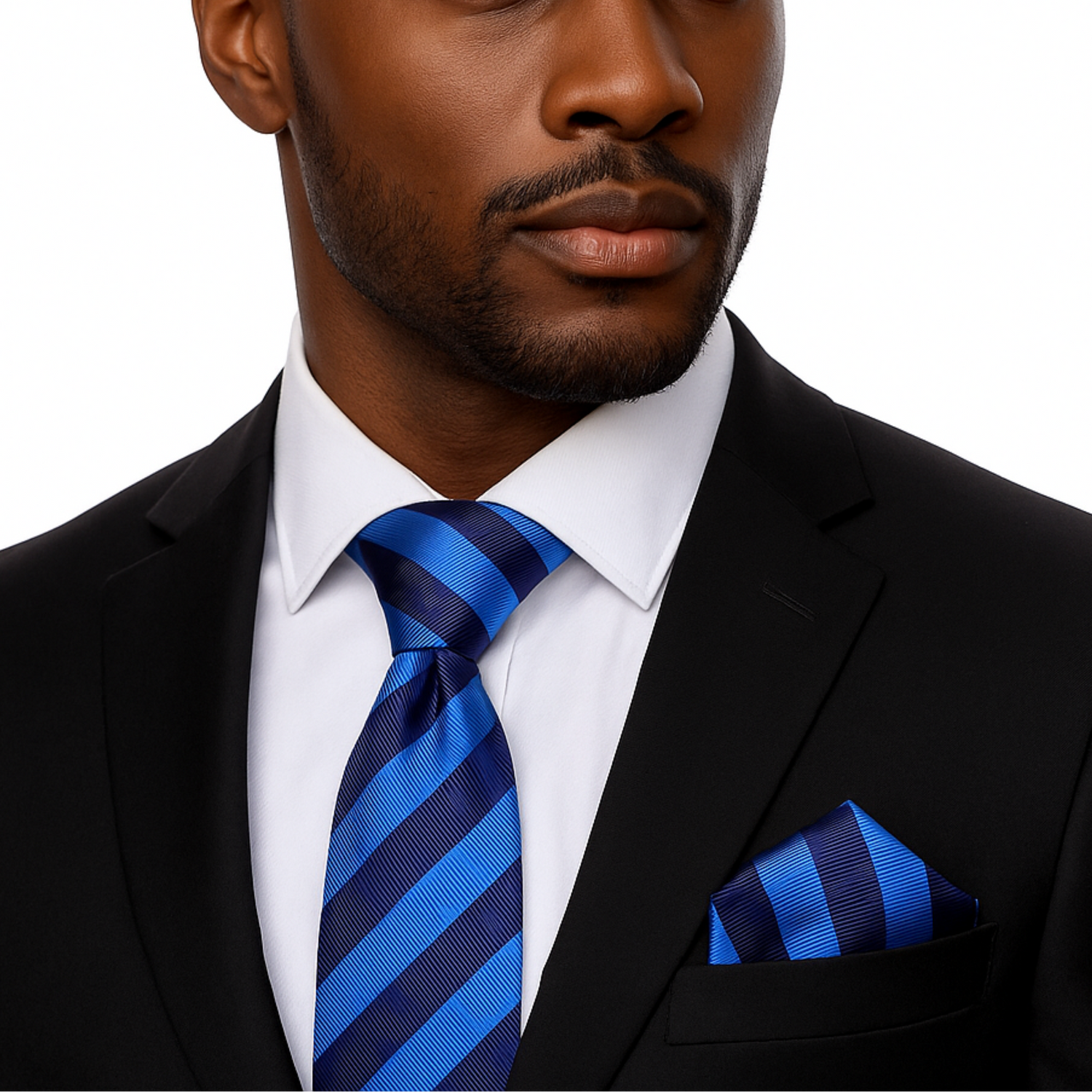 Man wearing a black suit with a blue striped tie and pocket square on a white background