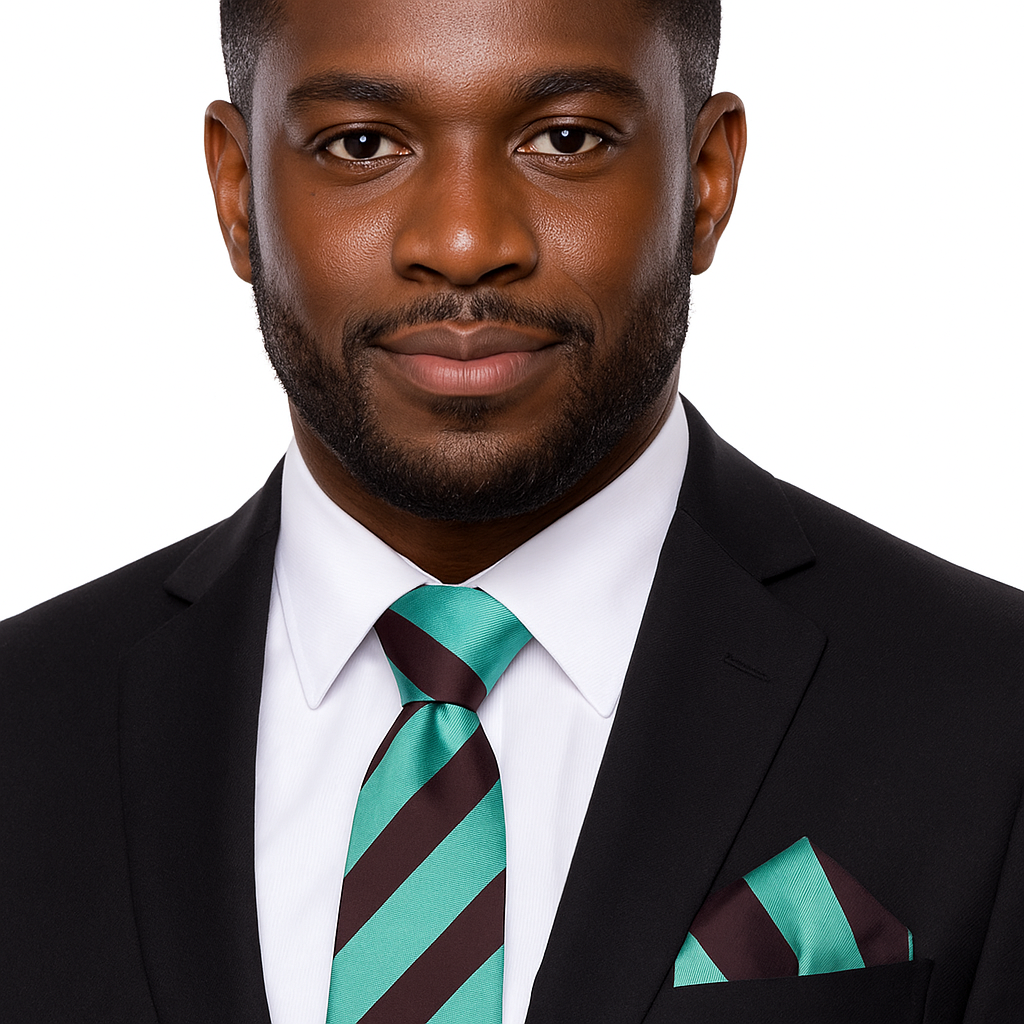 Man wearing a black suit with a green and brown striped tie and matching pocket square on a white background