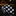 Black and silver polka tie with white polka dot pattern on a dark surface