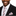 Man wearing a black suit with a striped grey and pink tie and pocket square on a white background