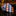 Rolled orange, blue, white check necktie on black marble