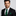 Man wearing green and black block stripe and matching square