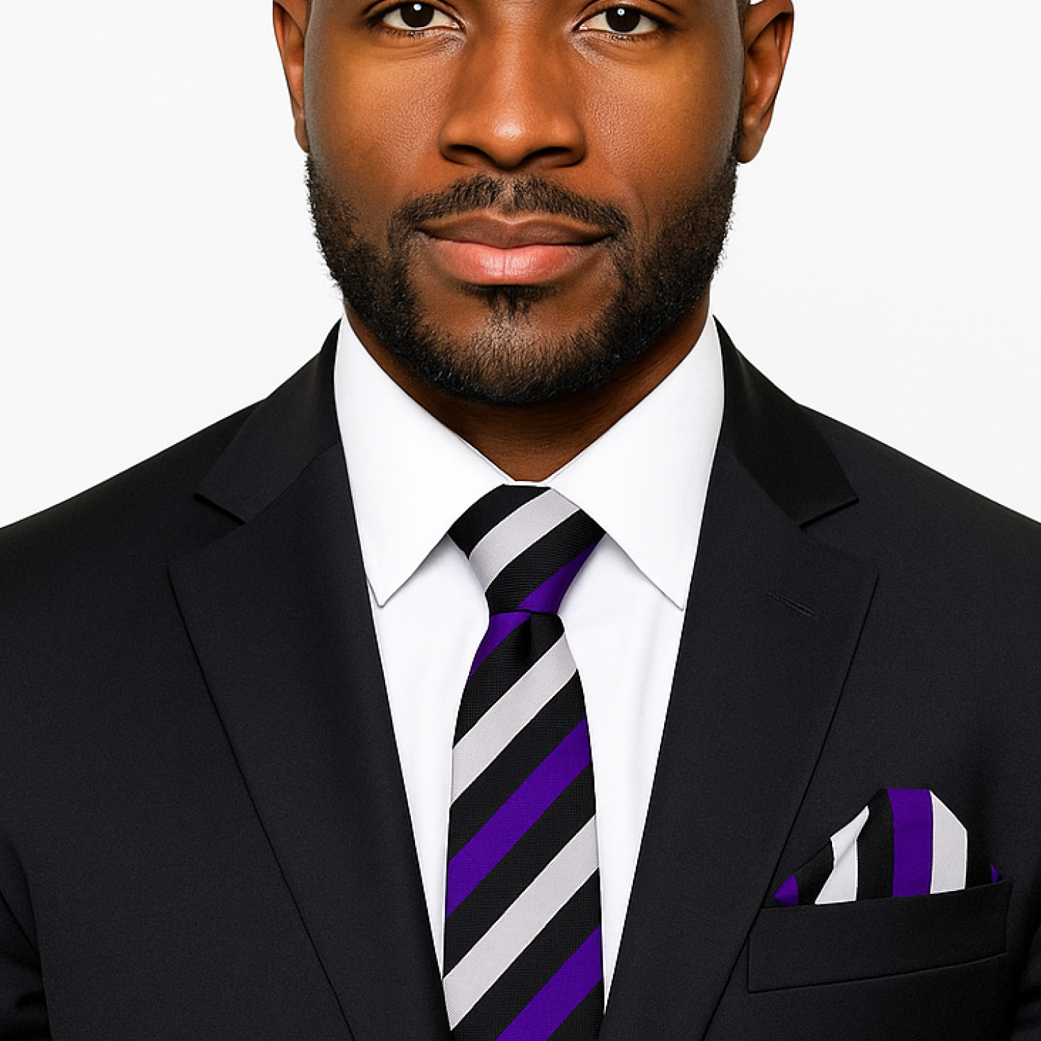 Man wearing a black suit with a purple and black tie and square