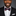 Man wearing a black suit with a red, white, and blue striped bow tie against a gray background