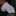 Colorful patterned object on a reflective surface with a blurred background