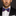 Man wearing a black suit with a Blue, Red, Blue Patriotic Stars Bow Tie and White Pocket Square