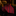 Red and black striped tie on a dark surface with blurred background