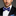 Man wearing a black suit with a white shirt and Blue, White Stripe Bow Tie and Blue Square||Blue