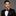 Red and black striped bow tie and pocket square  on man wearing suit