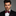 Red and black striped bow tie with accenting pocket square on man wearing suit