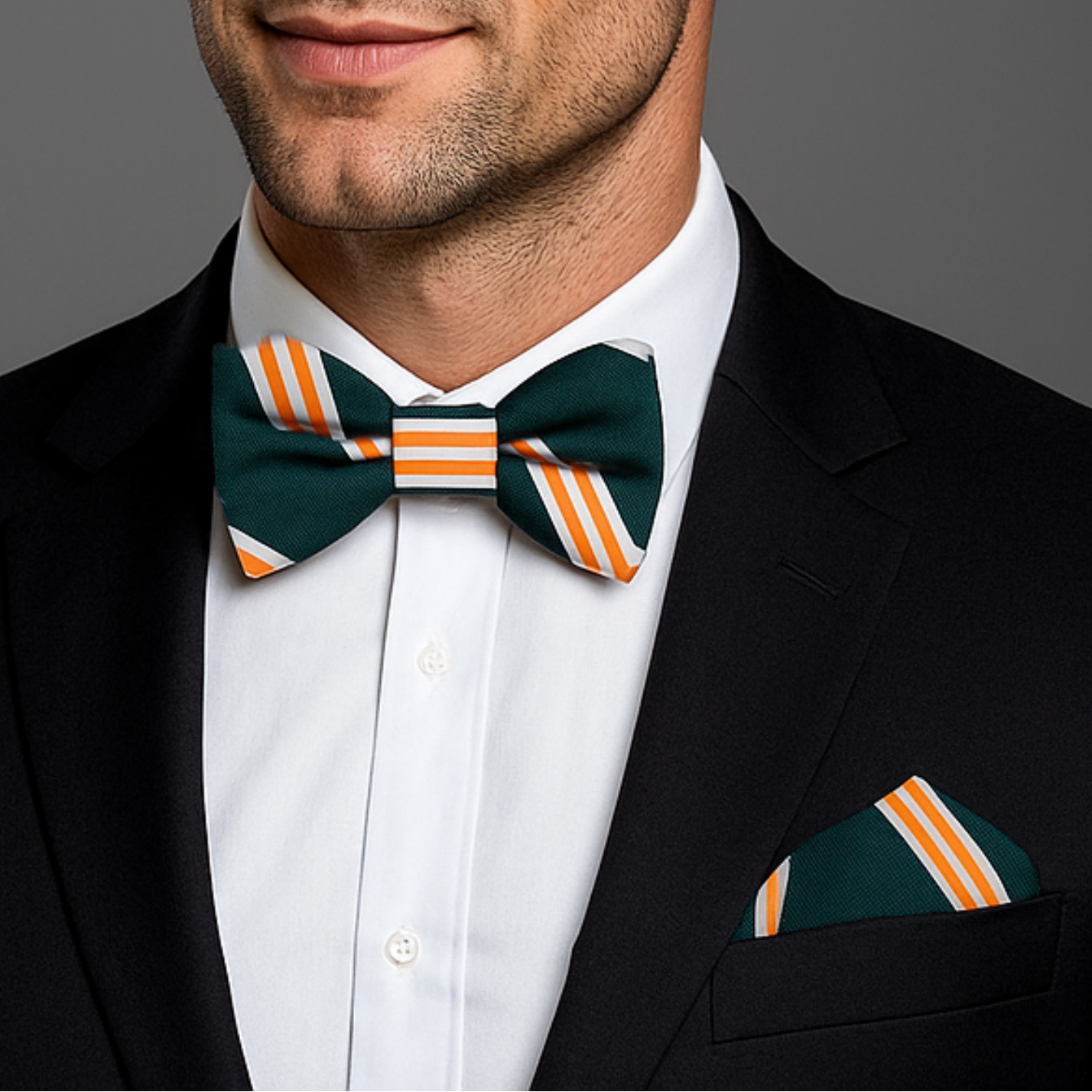 Man wearing a black suit with a Green, Yellow, White Stripe Bow Tie and Square