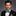 Man wearing a black suit with Teal White Black Stripe Bow Tie and Square