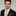 Man wearing a black suit with a Yellow and Blue Diamonds Necktie and Accenting Square 2