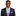 Man wearing a black suit with a purple tie on a white background