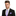 Man wearing a black suit with a white shirt, purple thin tie, and matching pocket square on a white background