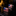 American flag cufflinks on a reflective surface with a blurred background
