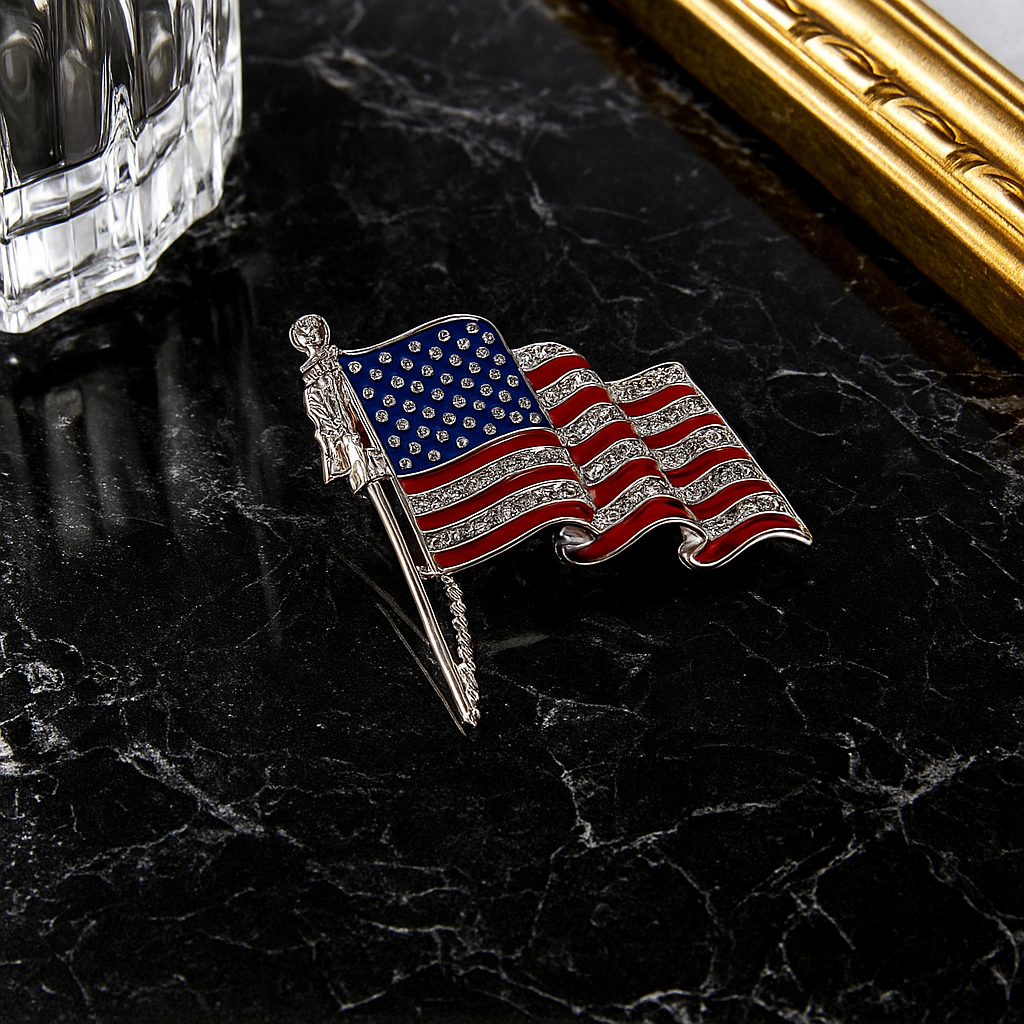 American flag pin on a dark marble surface with a gold frame and crystal object.