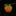 Colorful apple-shaped brooch with gemstones on a black background