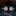 Silver cufflinks with pink gemstones on a reflective black surface