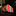 Rolled-up multicolored tie on a dark marble surface with a blurred background