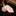 Beige tie rolled up on a dark surface with a blurred background