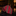 Folded red striped tie on a dark surface with a blurred background