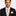 Man wearing a black suit with a Vanilla Ice Cream with Salted Caramel Drizzle Necktie, Matching Pocket Square on a white background