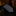 Black textured tie on a dark surface with a blurred background