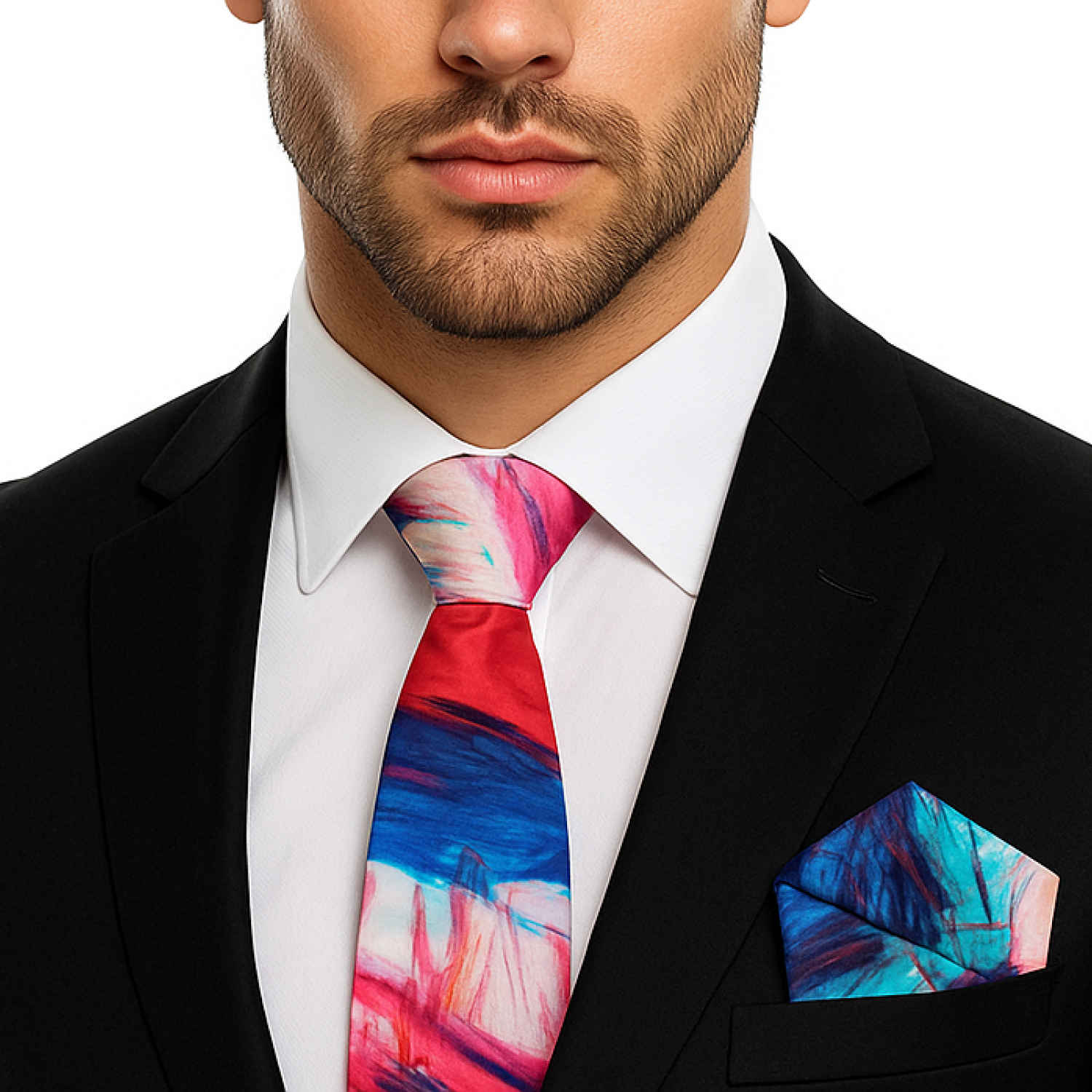 Man wearing a colorful tie and matching pocket square with a white shirt and black suit.
