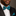 Man wearing a black suit with a blue and black patterned bow tie and matching pocket square.