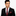 Man wearing a black suit with a red paisley tie and pocket square on a white background