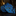 Blue paisley tie on a dark surface with a blurred background