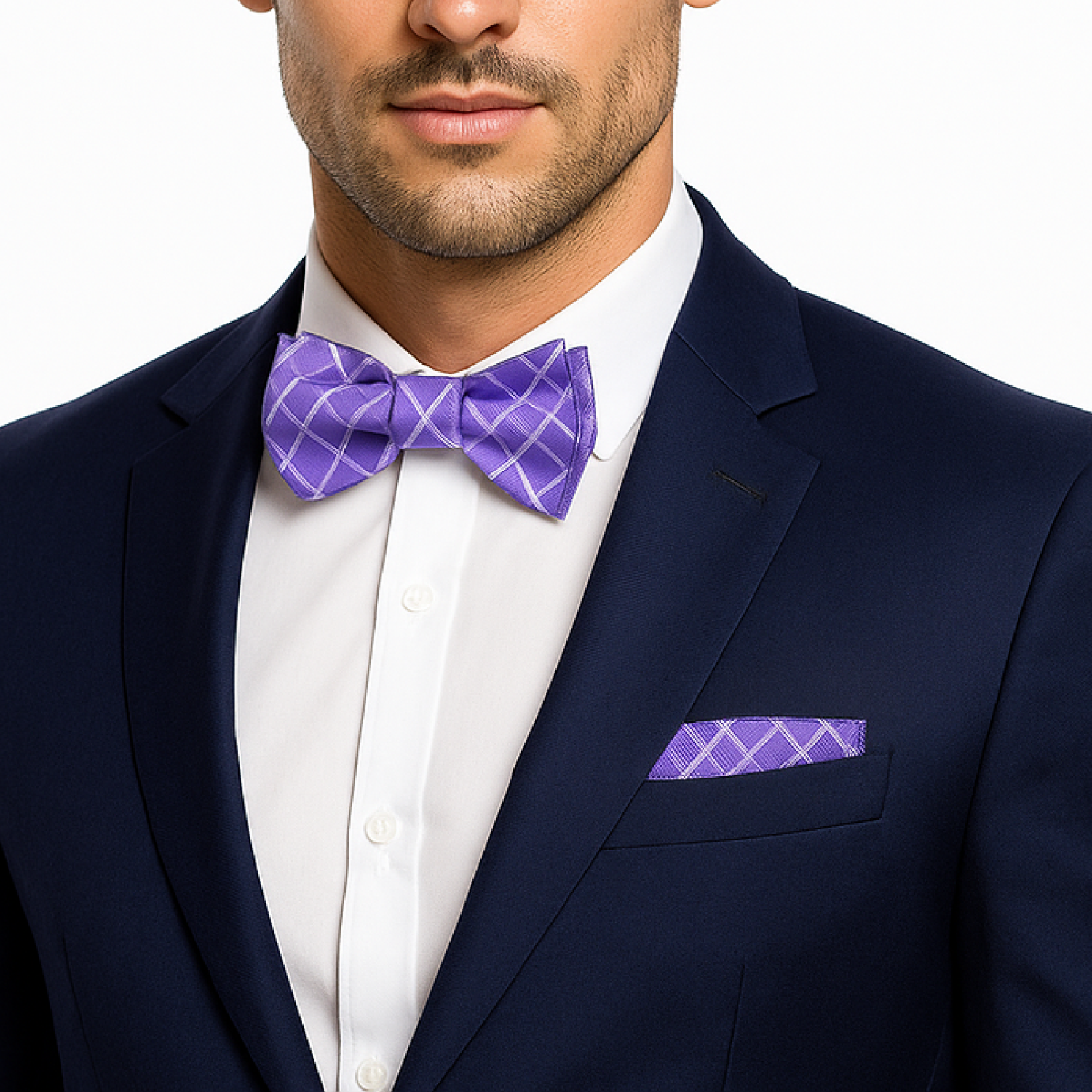 Man wearing a navy suit with a white shirt, purple checkered bow tie, and matching pocket square.