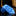 Blue marbled tie on a dark surface with a blurred background